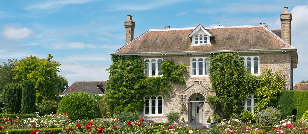A Picturesque English country cottage with rose garden, located in an English Village.