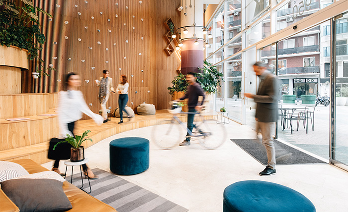 Commuters arriving in a modern office lobby