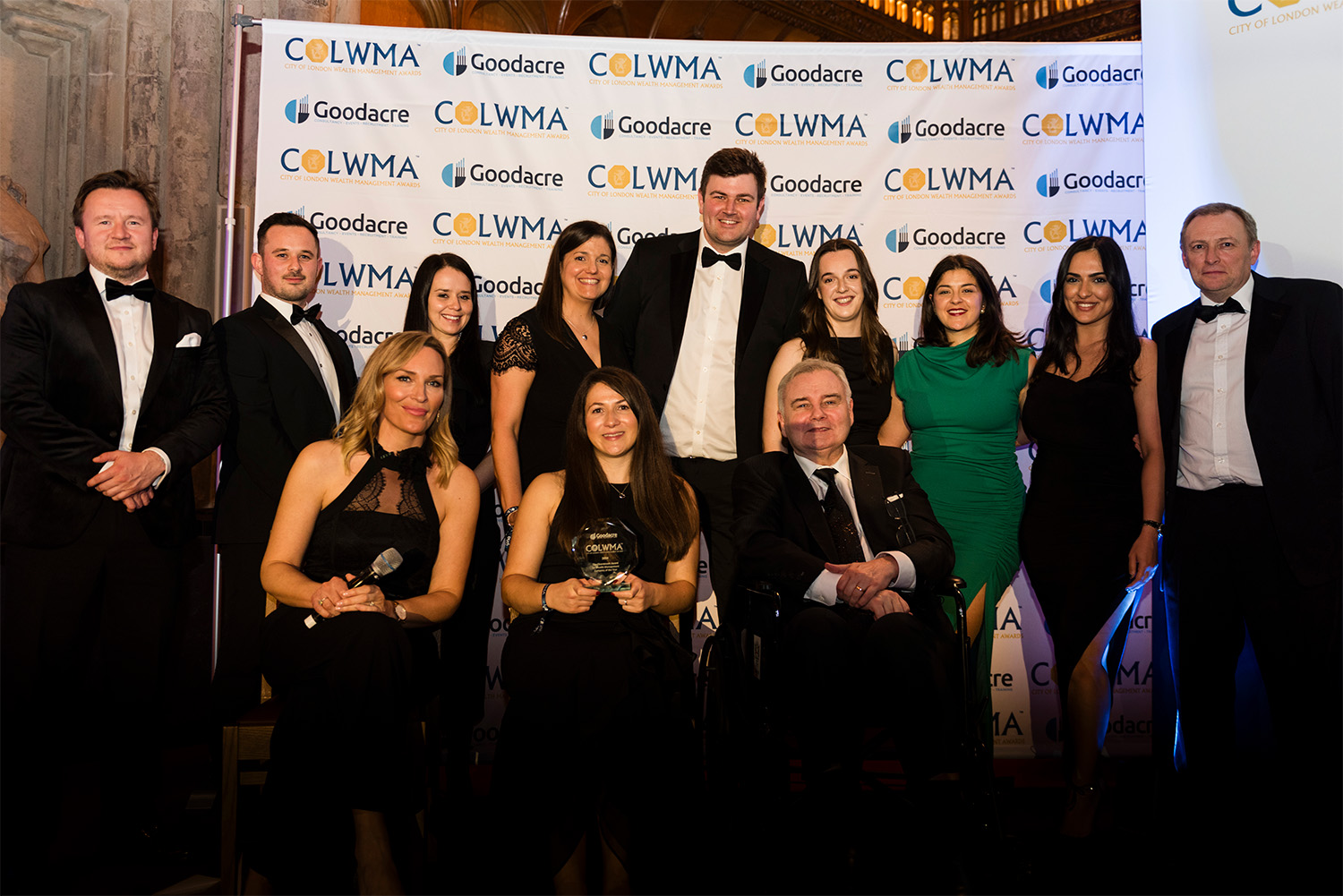 Our delighted colleagues collecting the COLWMA award trophy.
