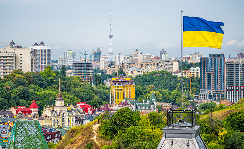 View of the Kiev cityscape with Ukrainian flag flying above