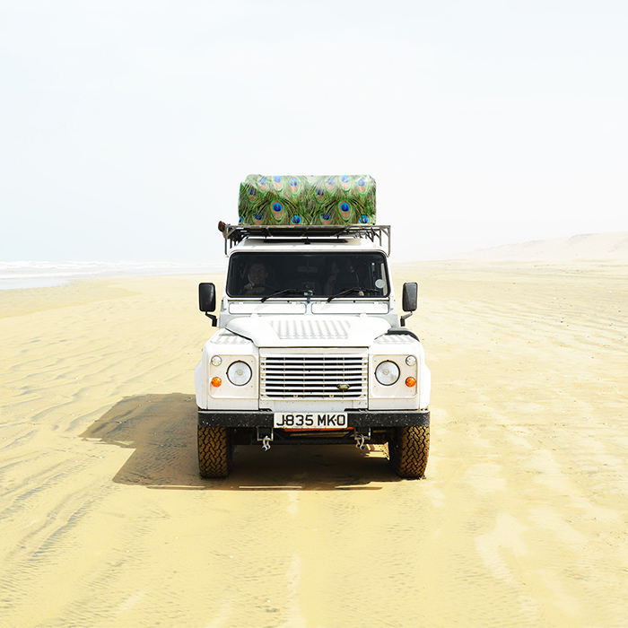 Land rover driving on sand