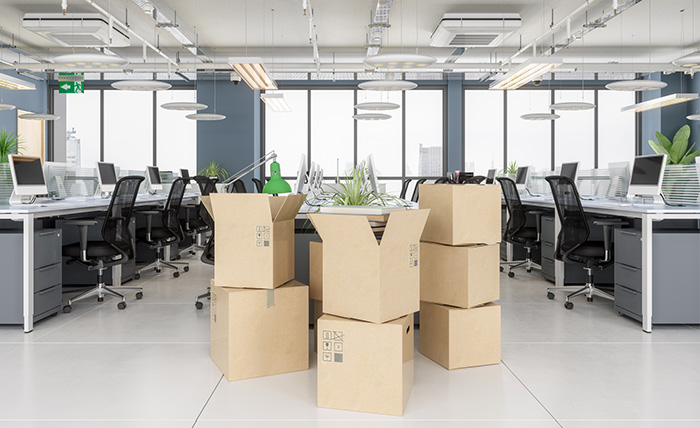 Boxes stacked in a modern office for a relocation