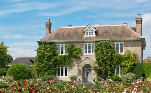A Picturesque English country cottage with rose garden, located in an English Village