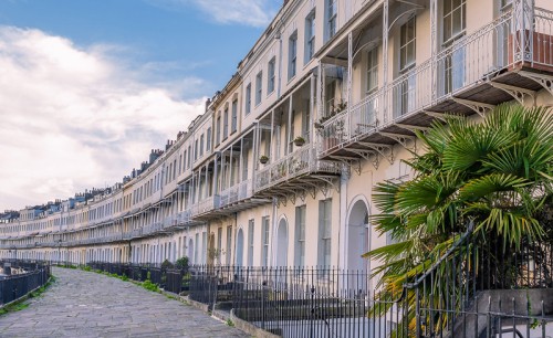 A row of houses in Royal York Crescent, Bristol, England under a beautiful cloudscape