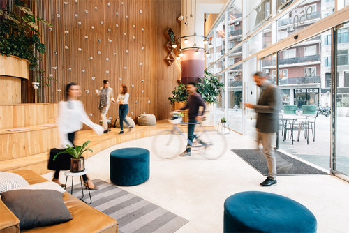 Commuters arriving in a modern office lobby