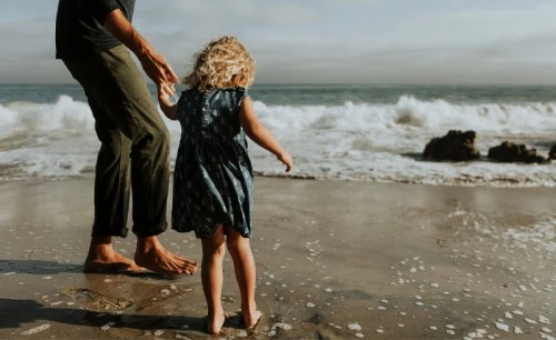 Father and daughter at a beach