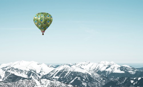 Hot air balloon over mountain