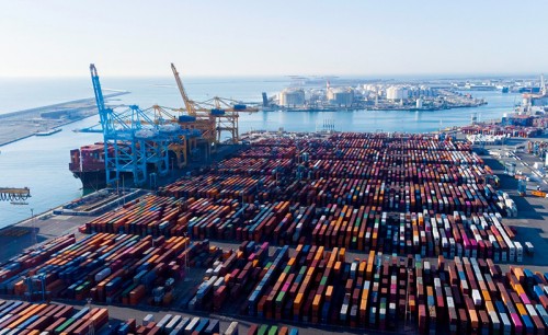 Aerial view of shipping containers and cargo ships in the sea port of Barcelona in Spain, Europe