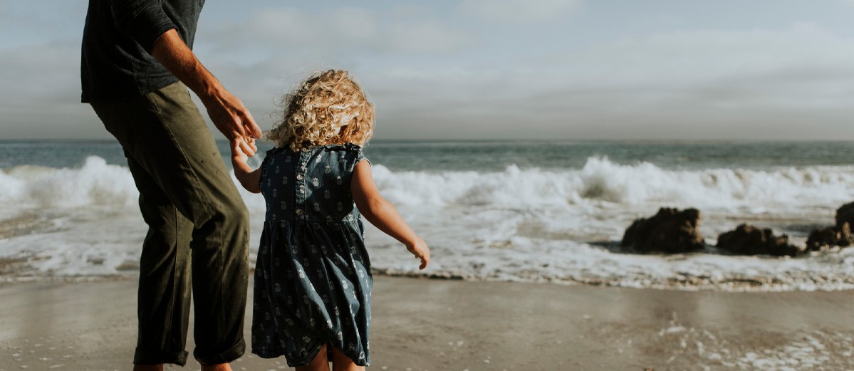 Father and daughter at a beach