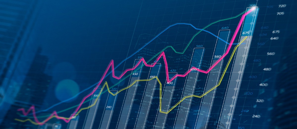 Business growth, progress or success concept. Financial bar chart and growing graphs with depth of field on dark blue background