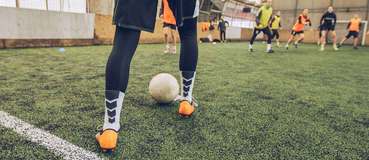 Footballer about to kick a ball during training