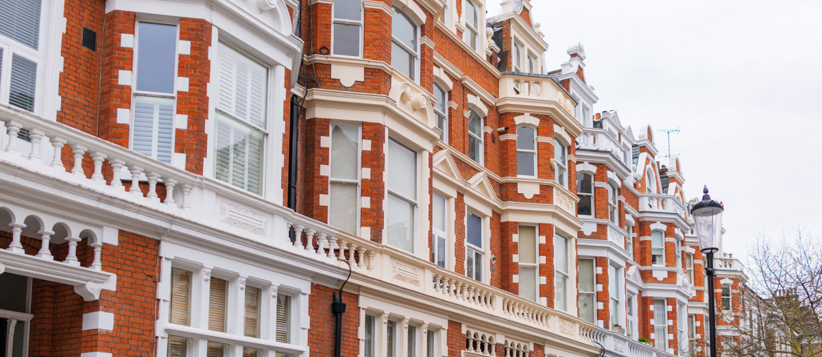 A street made up of brick-built apartments and townhouses in South Kensington, London