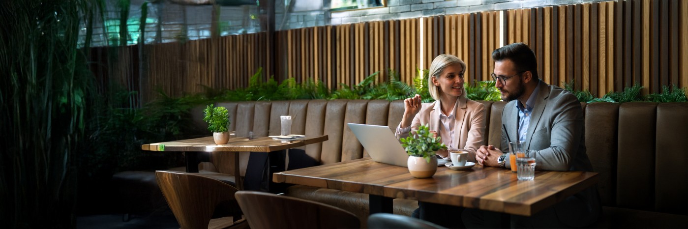 Business teammates making plans in a cafe