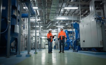 Two individuals in a plant facility