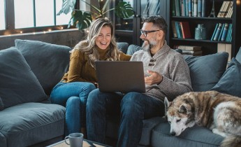 Couple and dog in the living room 
