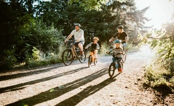 Family cycling outdoors
