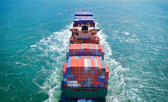 Aerial view of freight ship with cargo containers