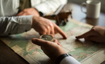 Men using map to plan a trip