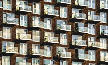 Windows and balconies on a modern apartment block.