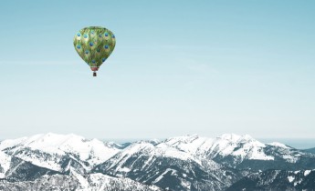 Hot air balloon over mountain
