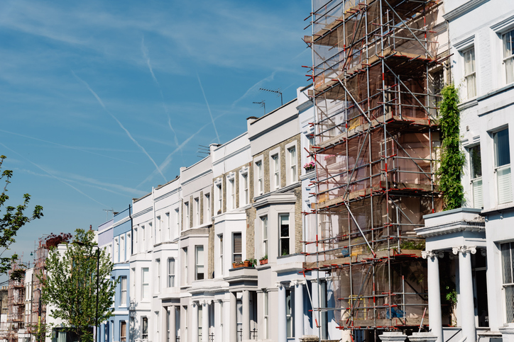 Traditional townhouses in Notting Hill, one of which is being restored.